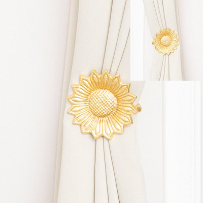 Melody Maison Set Of 2 Gold Metal Sunflower Wall Mounted Tie Backs from B&Q