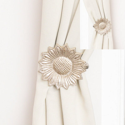 Melody Maison Set Of 2 Silver Metal Sunflower Wall Mounted Tie Backs from B&Q