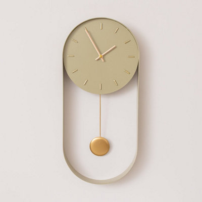 Melody Maison Olive Green & Gold Pendulum Metal Analogue Wall Clock20Cm X 55Cm from B&Q
