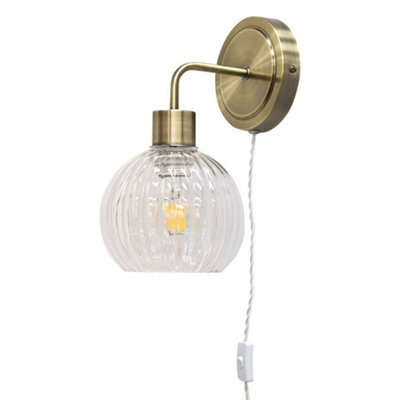 First Choice Lighting TobyAntique Brass Plug In Wall Light With Betchley Clear Shade from B&Q
