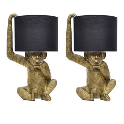 First Choice Lighting Set Of 2 NormanBlack And Gold Monkey Table Lamp from B&Q