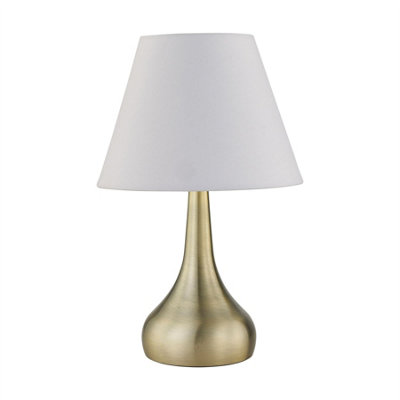 First Choice Lighting RomanaAntique Brass Touch Operated Table Lamp With Ivory Shade from B&Q