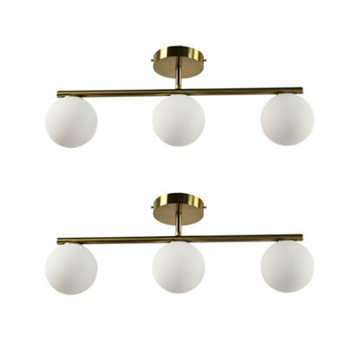 First Choice Lighting Set Of 2 Grosvenor Satin Brass 3 Light Bars With Glass Globes from B&Q