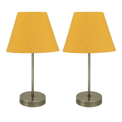 First Choice Lighting Set Of 2 Antique Brass Stick Table Lamps With Ochre Fabric Shades from B&Q