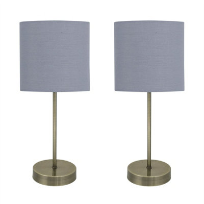 First Choice Lighting Set Of 2 Antique Brass Stick Table Lamps With Grey Cotton Shades from B&Q