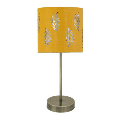 First Choice Lighting Antique Brass Stick Table Lamp With Ochre Cut Out Shade from B&Q