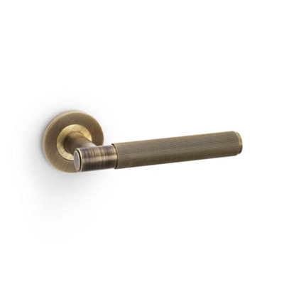 Alexander & Wilks Spitfire Reeded Lever On Round RoseAntique Brass from B&Q