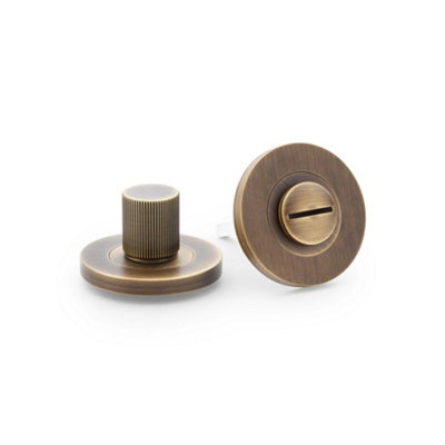 Alexander & Wilks Reeded Thumbturn And ReleaseAntique Brass from B&Q