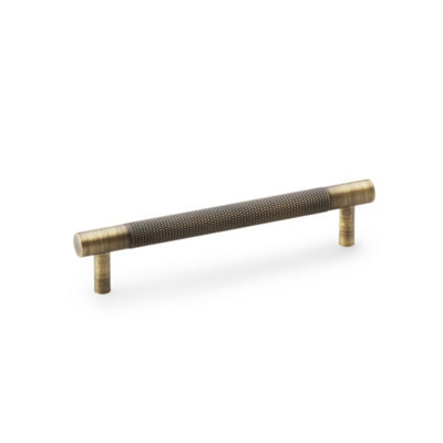 Alexander & Wilks Brunel Knurled T-Bar Cupboard HandleAntique BrassCentres 128mm from B&Q