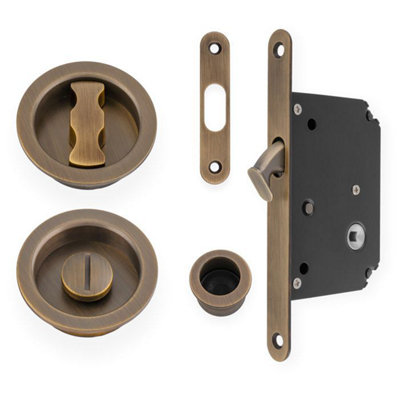 Alexander & Wilks Radius Sliding Door Lock SetAntique Brass from B&Q