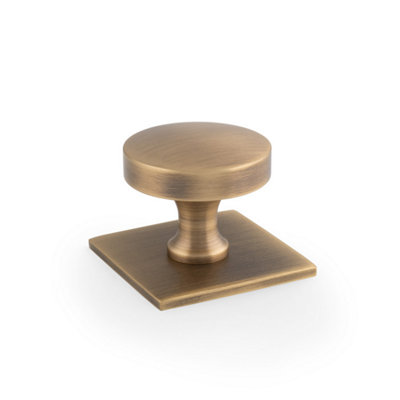 Alexander & Wilks Bullion Cupboard Knob On Square Backplate-Antique Brass from B&Q