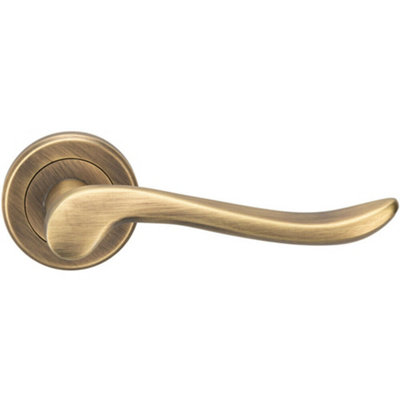 B&Q Pair Scroll Shaped Lever Handle On Round Rose Concealed Fix Antique Brass