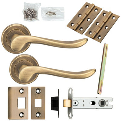 Door Handle & Latch Pack Antique Brass Scroll Lever Screwless Round Rose from B&Q