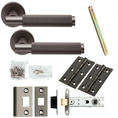 Door Handle & Latch Pack Matt Bronze Knurled Round Bar Screwless Round Rose from B&Q