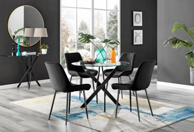 Furniturebox Novara Clear Tempered Glass 100Cm Round Dining Table With Black Starburst Legs & 4 Black Pesaro Soft Velvet Chairs from B&Q