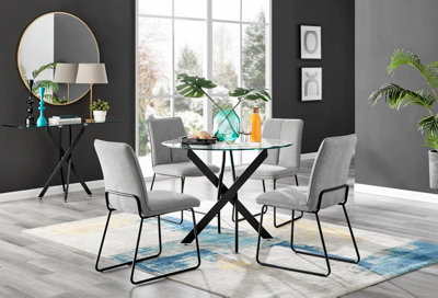 Furniturebox Novara Clear Tempered Glass 100Cm Round Dining Table With Black Starburst Legs & 4 Light Grey Halle Fabric Chairs from B&Q