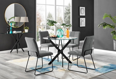 Furniturebox Novara Clear Tempered Glass 100Cm Round Dining Table With Black Starburst Legs & 4 Dark Grey Halle Soft Fabric Chairs from B&Q