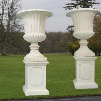  - Pair Of Giant Flute White Stone Garden Vases On Plinths