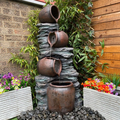 Outdoor Living Uk 4 Pouring Jugs On Rock Traditional Mains Plugin Powered Water Feature