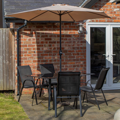 Samuel Alexander Outdoor 4 Person Rectangular Glass Top Garden Dining Table Chairs With Cream Parasol And Base Set from B&Q