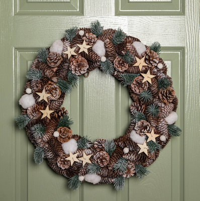 Samuel Alexander 50Cm Frosted Hanging Christmas Wreath With Pine Cones & Wooden Stars from B&Q