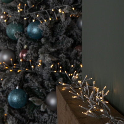 Samuel Alexander 9.3M 720 Led Christmas Cluster String Lights With Timer In Warm White On Clear Cable from B&Q