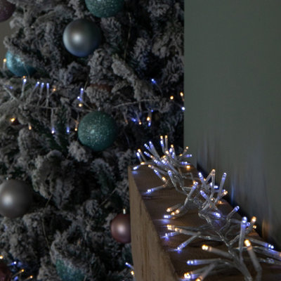Samuel Alexander 9.3M 720 Led Christmas Cluster String Lights With Timer In White & Warm White On Clear Cable from B&Q