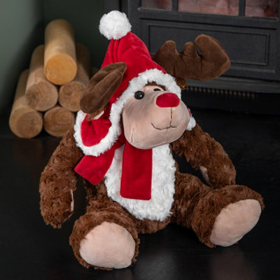 Samuel Alexander 30Cm Sitting Plush Christmas Reindeer With Red Hat & Scarf from B&Q