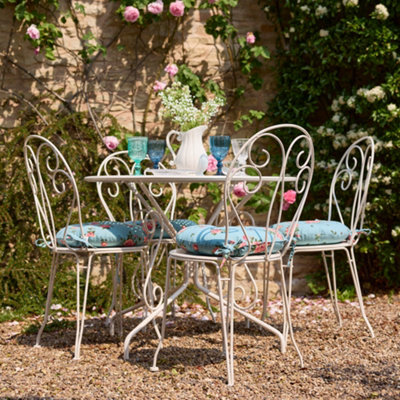 Dibor Traditional Style Four Person Indoor Outdoor Garden Iron Bistro Table And Chairs Set With Free Seat Pads from B&Q