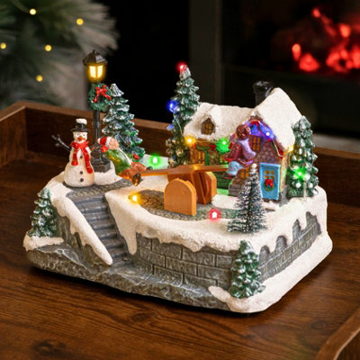 Marco Paul Musical Christmas Village Led DecorationSee Saw from B&Q
