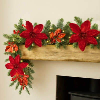 Marco Paul 9Ft Artificial Led Christmas Garland With Red Flowers from B&Q