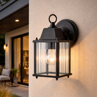 CGC Interiors Cgc Santiago Mini Black Coach Lantern Wall Light With Ribbed Glass from B&Q