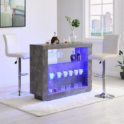Furniture in Fashion Fiesta Concrete Effect Bar Table With 2 Ripple White Stools from B&Q