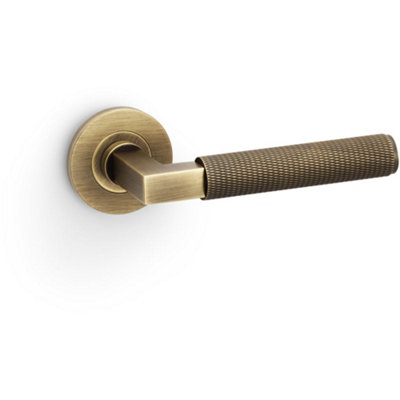 B&Q -  Solid Brass Knurled Door Handle SetAntique Brass Angled Lever On Round Rose