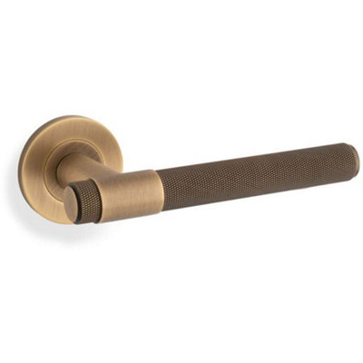 B&Q -  Solid Brass Knurled Door Handle SetAntique Brass Bar Lever On Round Rose