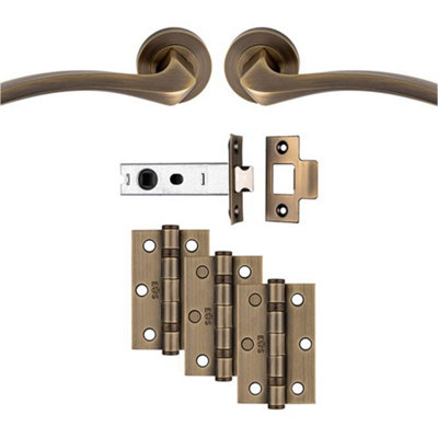 Loops Premium Door Handle & Latch PackAntique Brass Curved Square Lever Round Rose from B&Q