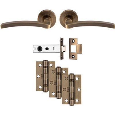 Loops Premium Door Handle & Latch PackAntique Brass Slim Curved Lever Round Rose from B&Q