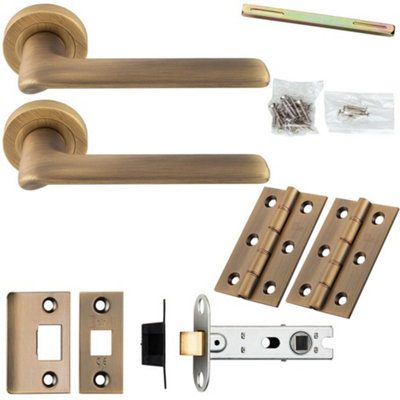 Loops Door Handle & Latch PackAntique BrassSlim Rounded Lever On Round Rose from B&Q