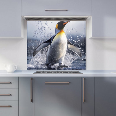 Warren Reed Designer Regal Penguin In A Watery Burst Kitchen Splashback from B&Q