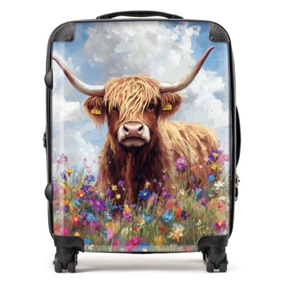 Warren Reed Designer Highland Cow In A Summer Meadow SuitcaseLarge from B&Q