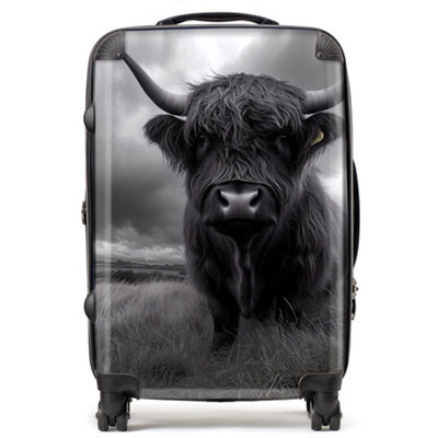 Warren Reed Designer Black And White Highland Cow SuitcaseMedium from B&Q
