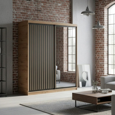 Delia 180 Black Sliding Door Wardrobe Modern Design With Mirror And Decorative Slats from B&Q
