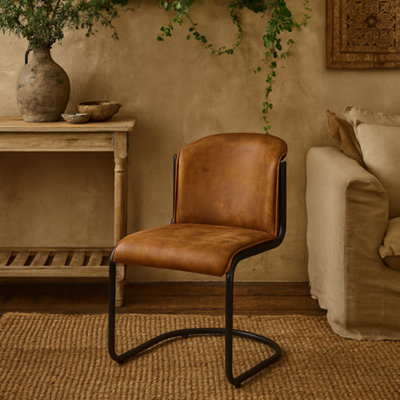 Wyld Haus Germain Arched Tan Faux Leather Dining Chair With Black Cantilever Frame from B&Q