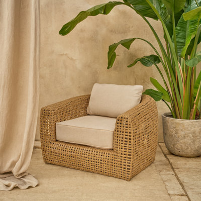 Wyld Haus Sardinia Large Rattan Outdoor Lounge Chair Natural Wicker With Cream Cushions from B&Q