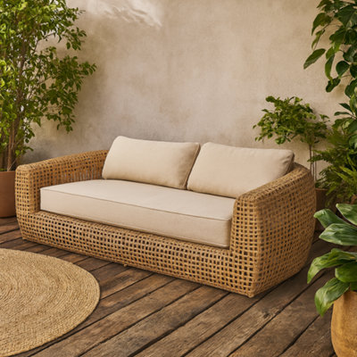 Wyld Haus Sardinia 2-Seater Natural Rattan Outdoor Sofa With Cream Cushions from B&Q