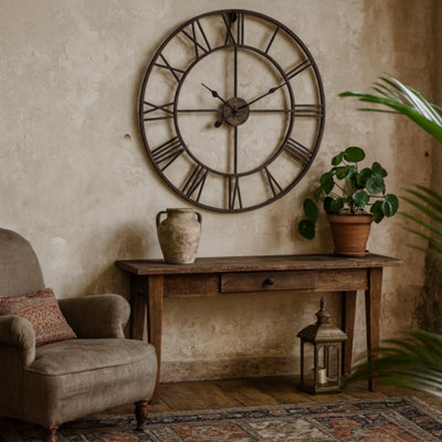 Wyld Haus Minimalist Bronze Metal Open Frame Wall Clock With Roman Numerals from B&Q