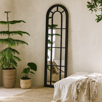 Wyld Haus Slim Tall Black Wood Arched Panel Window Mirror from B&Q