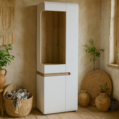 Wyld Haus Foxwhisk Tall Glazed Narrow Display Unit White Gloss With Truffle Oak Effect Right Hand from B&Q