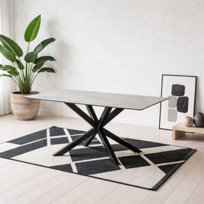 Wyld Haus Perth 135Cm Grey Ceramic 4-Seater Dining Table With Matt Black Metal Cross Base from B&Q