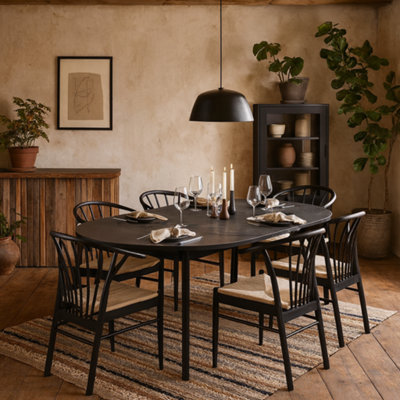 Wyld Haus Krakow Black Round Extending Dining Table With 6 Scandinavian Chairs from B&Q